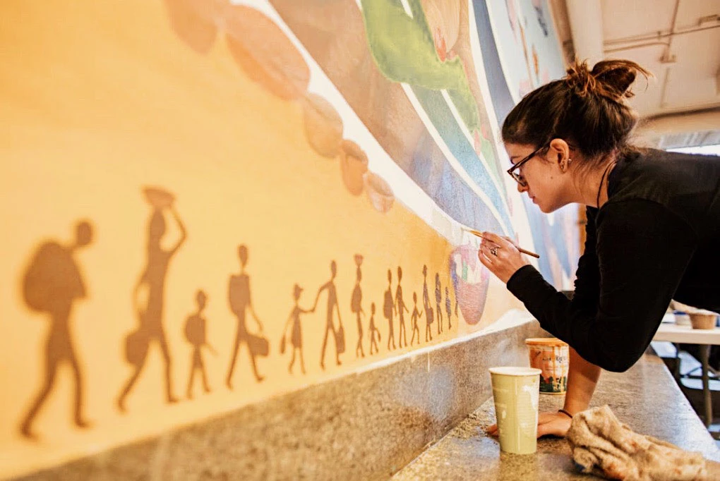Pachamama mural section with goddess and nature symbolism.