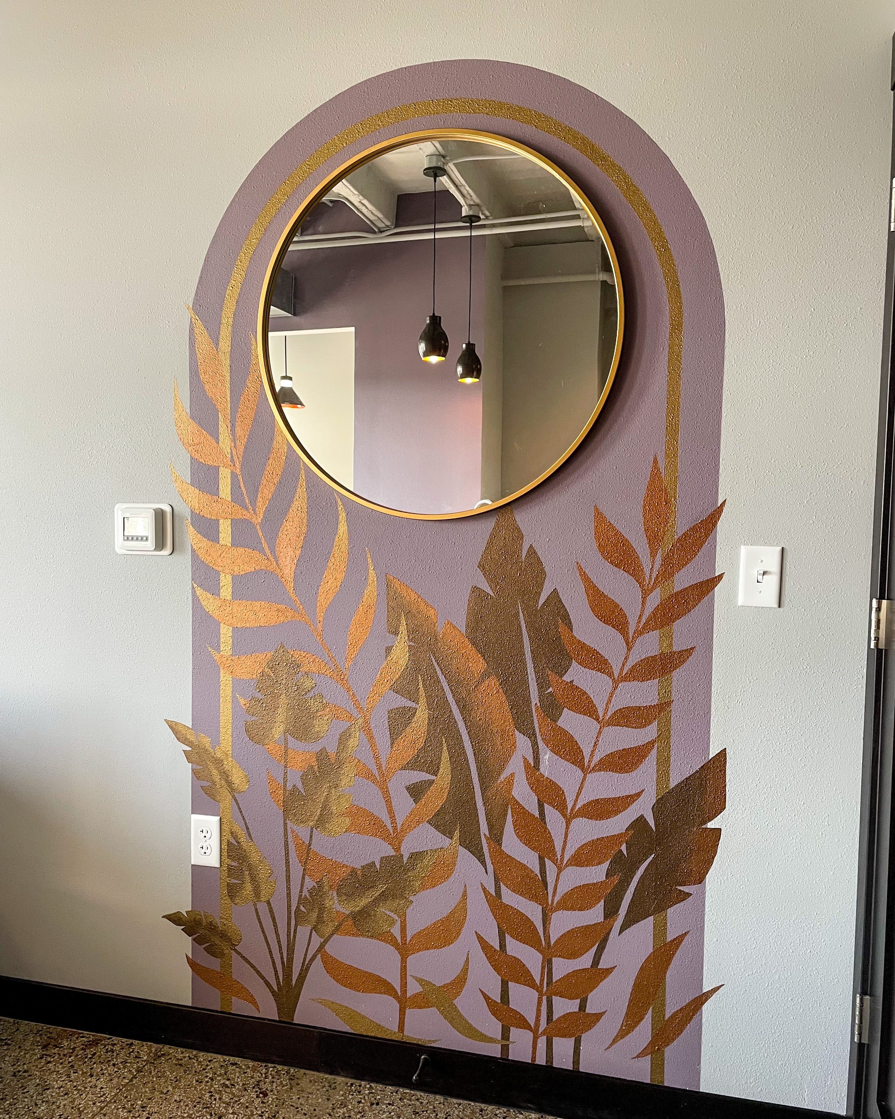 Grand Apartments mural in context against the lobby finishes.